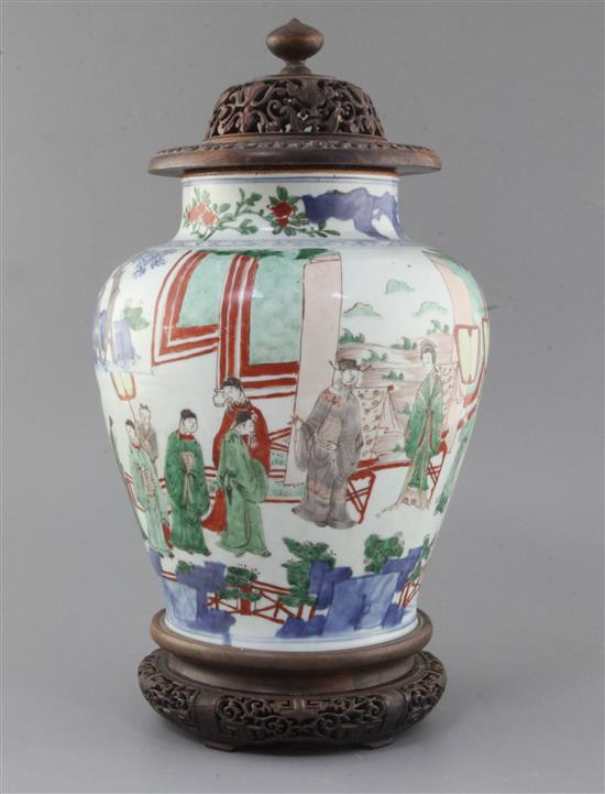 A Chinese wucai baluster jar, Transitional period, 17th century, height 28cm excl. carved hongmu stand and cover